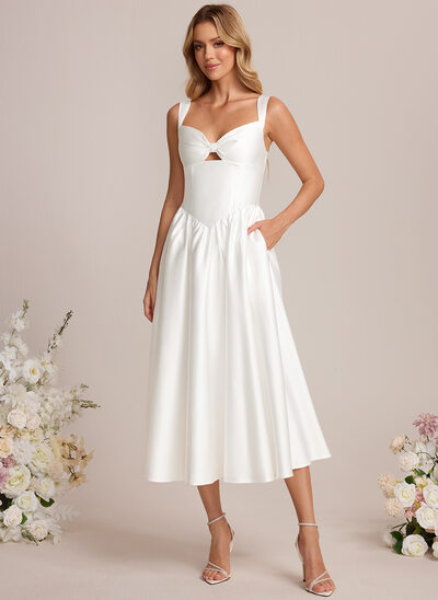 Robe trapèze à avec poches en satin stretch